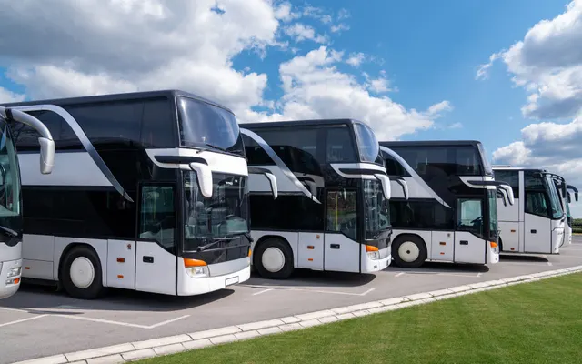 Row of modern double-decker buses ready for transfers